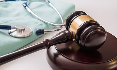 Gavel And Stethoscope In Background Medical Laws